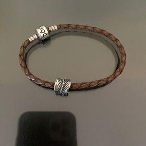 Pandora leather bracelet with feather charm